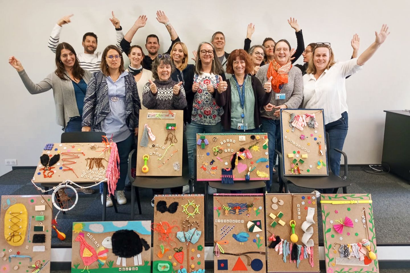 Group of volunteers with art projects